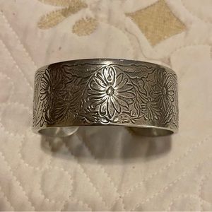 Nice pewter cuff with flowers.